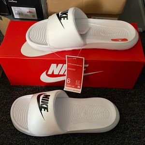 White NIKE slides. Size 6